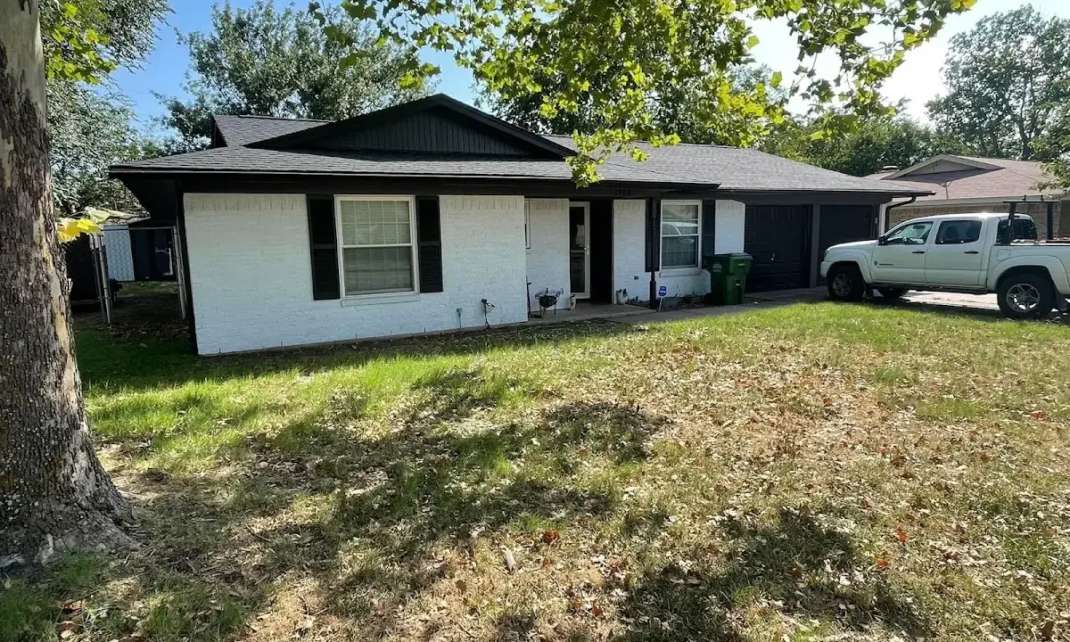 Professional roofing crew working on a residential roof in Lake Barrington